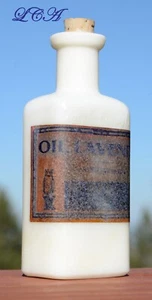 ANTIGUA botella blanca BÚHO DRUG Co VIDRIO DE LECHE RARA con etiqueta desgastada ACEITE DE LAVANDA - Imagen 1 de 5