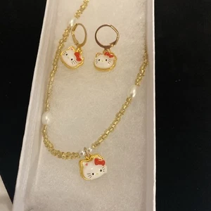 Sanrio Hello Kitty 3-Piece Gold & Pearl Matching Earring & Necklace Set- Red Bow - Picture 1 of 8