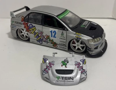 Juguetes Mitsubishi Lancer Evolution VIII 1:18 Importación Corredor Jada Plateados (Sin Espejos) Foto 1 de 4