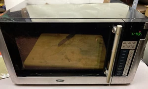 OSTER 1.1 CU. FT.  COUNTERTOP MICROWAVE OVEN pre owned - Picture 1 of 10