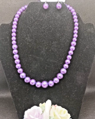 Juego de collar y pendientes de cuentas redondas moradas  Foto 1 de 4