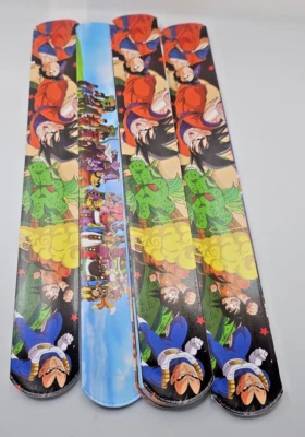 32 peças de pulseiras de tapa dragões e outros personagens 2 de cada design. (A1) - Imagem 1 de 4