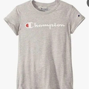 Neu mit Etikett Champion Mädchen T-Shirt klassisch Rundhalsausschnitt Tee Größe Medium meliert grau 3D12 - Bild 1 von 3