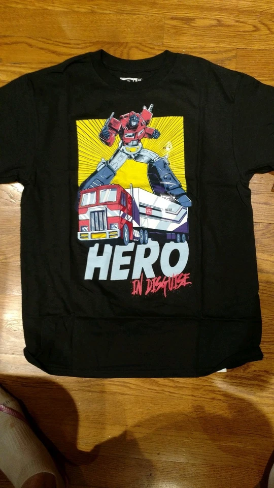 CAMISETA NEGRA TRANSFORMERS HERO IN DISGUISE OPTIMUS NUEVA CON ETIQUETAS 16/18 NIÑOS $20 venta al por menor Foto 1 de 1
