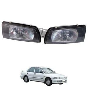 For 1992-1994 Mitsubishi Lancer E-Car Ecar Evo 1 2 3 Head Lamp Lights Black Pair - Picture 1 of 6