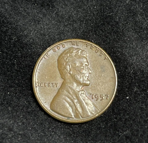 Rare 1957 Lincoln Wheat Penny. No Mint Mark. Very nice toning, error on "L" Cover