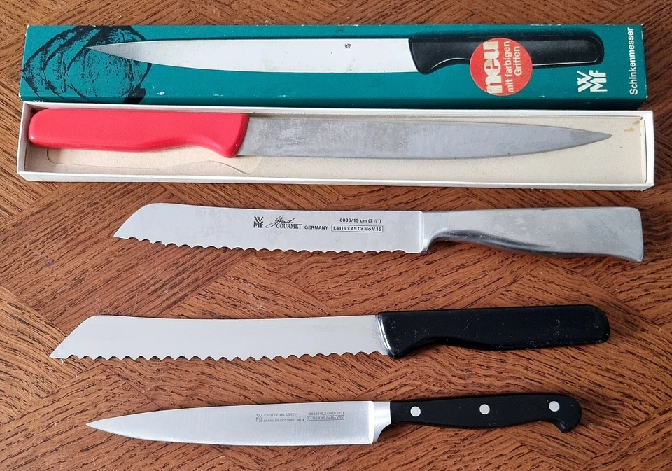 4 gut erhaltene WMF Küchenmesser -  Brot / Bratenmesser -  Schinkenmesser - Bild 1 von 4