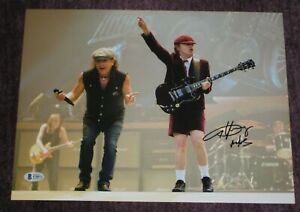ANGUS YOUNG Signed AC/DC in Concert 11x14 PHOTO with Beckett COA