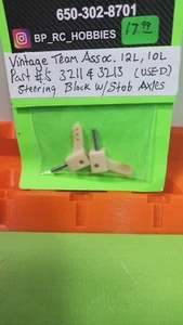 Vintage Team Associated 12L,10L PART'S # 3211&3213 USED STEERING BLOCKW/STUBaxle - Picture 1 of 1