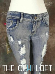 Pantalones de mezclilla ajustados para mujer desgastados suaves elásticos destruidos en piernas y cristales - Imagen 1 de 7