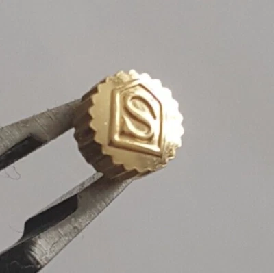 Corona chapada en oro a prueba de polvo Sandoz Foto 1 de 4