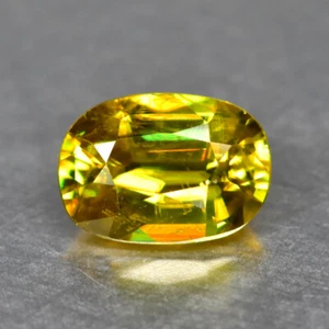 0.94Ct Oval_Exquisite Lustrous Unheated Multi Color Titanite Sphene - Picture 1 of 1