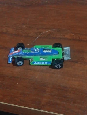 Coche Indy Malasia Ziplock vintage Hot Wheels verde y azul promoción 1982, dañado Foto 1 de 4