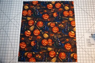 Alexander Henry Halloween Bell Knobs And Broomsticks Pumpkin Fabric Cotton 20x23 - Image 1 of 2