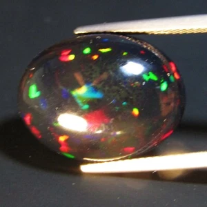 Piedra preciosa ovalada de ópalo negro juego multicolor natural de disparo de 10,34 quilates de Etiopía - Imagen 1 de 4