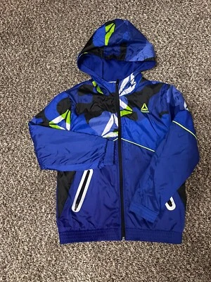Chaqueta cortavientos Reebok para niños - azul/negro - cremallera completa usada talla 8 (M) Foto 1 de 3