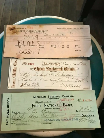 is   3 Obsolete Checks MI Smelting Co, Iron Cliffs Co., Copper Range Co Cover