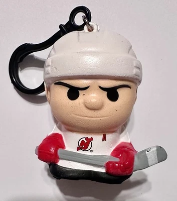 2026 NHL SqueezyMates Jack Hughes New Jersey Devils Foto 1 de 2