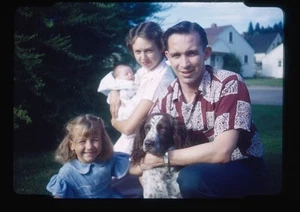 Red Boarder Family with Dog and Baby in Outdoor Setting - Imagen 1 de 2