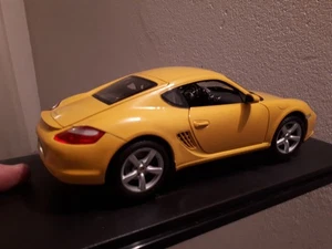 PORSCHE CAYMAN S scala 1/18 WELLY nuovo - Foto 1 di 4