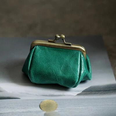 Bolso de cosméticos de lápiz labial de cuero genuino Bolso de maquillaje para mujeres Mini bolsa de artículos de tocador Foto 1 de 4