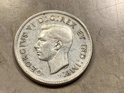 Canada 1938 Silver 25 cents VF Condition SKU# 35202 - Image 1 of 2