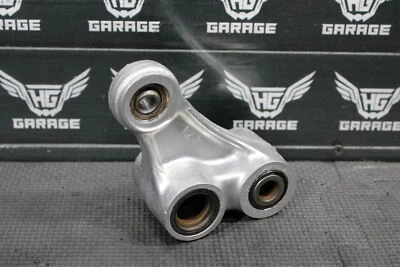 Honda CR250R 1990 OEM Dogbone trasero acoplamiento amortiguador enlace 52460-KZ3-702 Foto 1 de 4