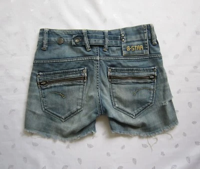 Pantalones cortos de mezclilla G-STAR RAW para mujer con bolsillos traseros con cremallera cortados en lavado medio W25 Foto 1 de 4