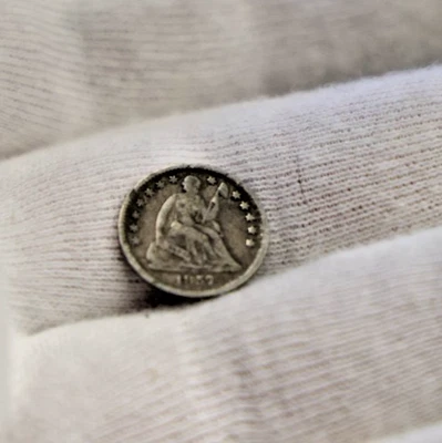 Media moneda de diez centavos fina de 1/2 Estados Unidos 1857 (limpiada, retonizada) Foto 1 de 2