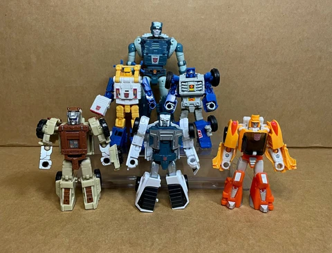 Transformers Beachcomber Tailgate Seaspray Wheelie Kup Outback Titans Return G1 Cover