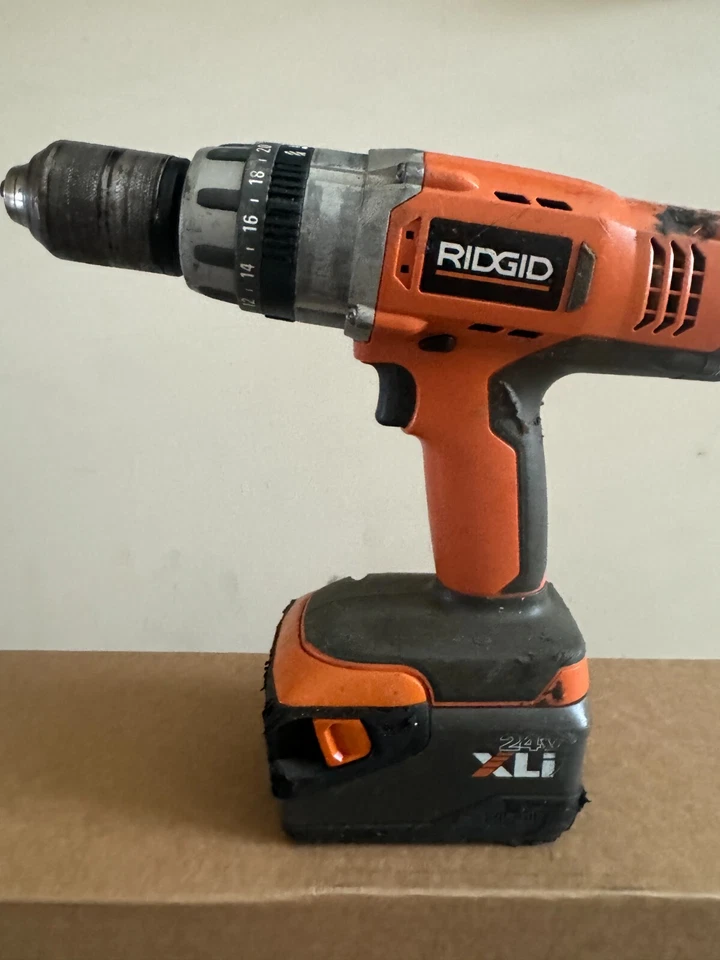 Taladro inalámbrico rígido 24V sin escobillas - naranja con batería Foto 1 de 3