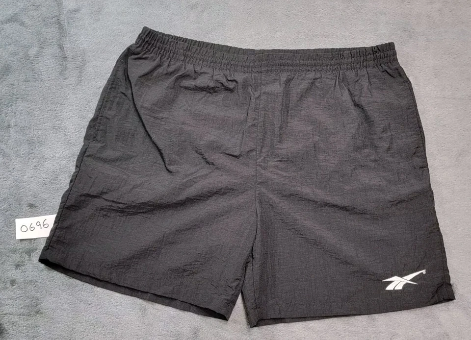 Bañador corto vintage años 90 Reebok forrado estampado trasero talla grande bordado negro Foto 1 de 4