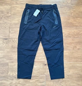 Neu mit Etikett Nike Tech gewebte Herrenhose Größe XL schwarz schmal zulaufendes Bein Standard Passform normale Passform - Bild 1 von 13