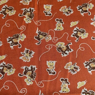 Everything But The Kitchen Sink Cowboy Fabric Horses Roping Orange Brown 1+ Yds - Image 1 of 4