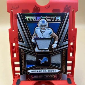 2023 Obsidian Amon-Ra St Brown Trifecta Patch #TRI-AST 3/49 Multi-Color SSP - Bild 1 von 6