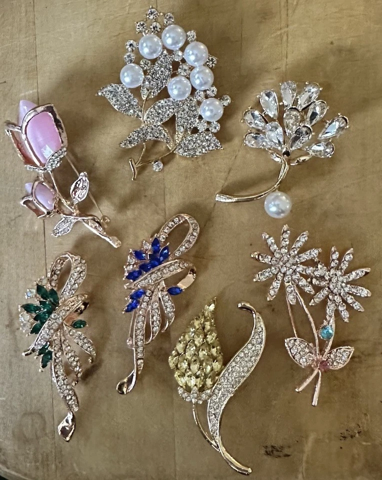 A Collection Of Women’s Fashion Rhinestone & Pearl Brooches - image 1 of 1