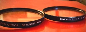 LOT OF 2 67 MM LENSES: ROKUNAR 1A Skylight FILTER PLUS TOYO OPTICS SKYLIGHT - Picture 1 of 1