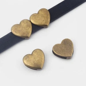 10 PIEZAS Espaciador deslizante antiguo en forma de corazón de bronce se adapta a cable de cuero plano de 10*2 mm - Imagen 1 de 3