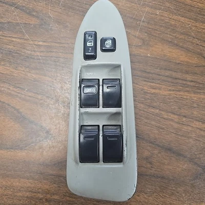 Interruptor de bloqueo de ventana eléctrica maestro conductor delantero izquierdo Toyota Camry 1997-2001 OEM Foto 1 de 4