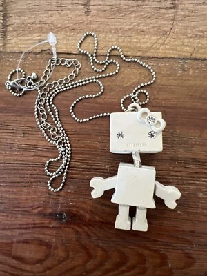 Cute Articulated Girl Robot Bow Pendant Necklace Ivory Tone Enamel Crystal Eyes - Image 1 of 4