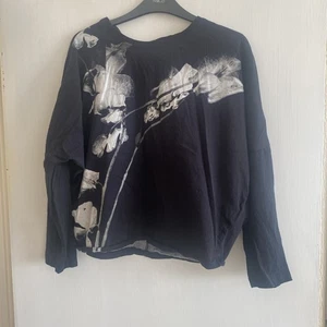 Religion Long Sleeved Black Top With White Flower Print On The Front. - Picture 1 of 11