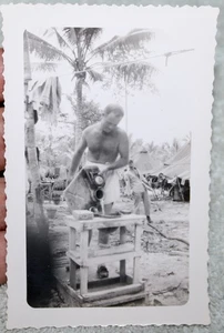 ORIGINAL WWII PHOTO GI IN UNDERWEAR POURING WATER INTO HELMET IN MAKESHIFT SINK - Picture 1 of 3