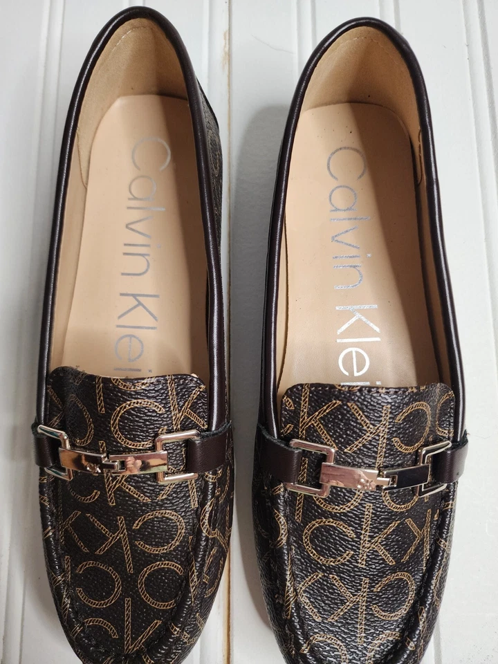 Cute, loafer-style, Women's size 6.5 flats. CK pattern & gold buckle feature. - Image 1 of 4