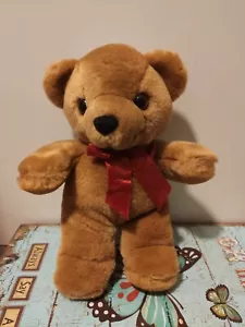 Orsetto Peluches di seconda mano colore marrone chiaro con fiocco rosso - Foto 1 di 1