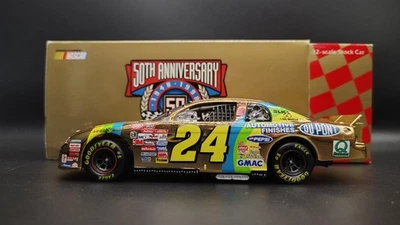 1998 Jeff Gordon #24 DuPont Automotive Finishes Action 1:32 Scale 24kt Gold - Image 1 of 4