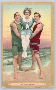Postcard The Prize Winner - Two Men Carrying Pretty Woman Old Time Swim Suits - Picture 1 of 3