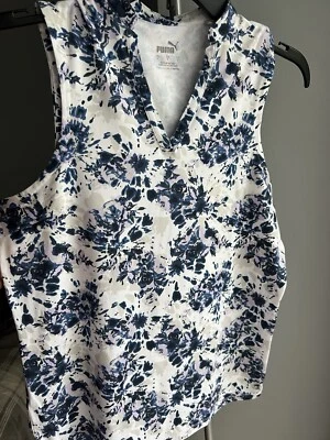 Blusa deportiva floral con cuello en V multicolor sin mangas talla pequeña Puma para mujer  Foto 1 de 4