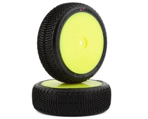 JConcepts Fuzz Bite LP pink Reifen 1/10 4WD Buggy Reifen vorne auf gelber Felge - Bild 1 von 3