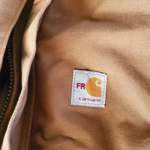 Chaqueta de bombardero con capucha forrada con edredón CARHARTT FR para tareas de trabajo talla XL 2112 - Imagen 1 de 9