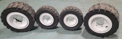 Bonito juego limpio de neumáticos y ruedas sólidas para carretilla elevadora industrial Yale Hyster Foto 1 de 4